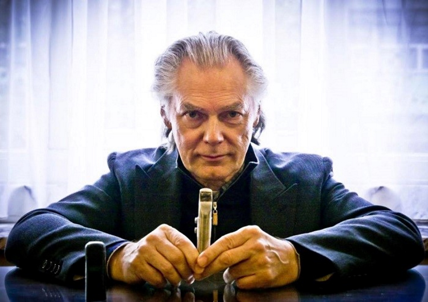 Norwegian jazz musician Jan Garbarek poses with a saxophone tip